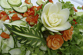 Food carving, making flowers from fruit and vegetables for salad