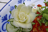 Food carving, making flowers from fruit and vegetables for salad