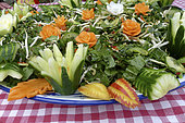 Food carving, making flowers from fruit and vegetables for salad