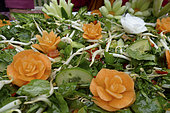 Food carving, making flowers from fruit and vegetables for salad