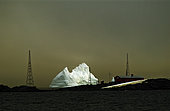 Iceberg drifting to the outskirts of the Melchior Antarctic base, Argentina, Antarctic Peninsula.