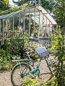 Bicycle in front of a greenhouse, Jardin Insolite, Parc Floral Vincennes, Paris, France