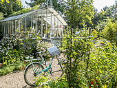 Bicycle in front of a greenhouse, Jardin Insolite, Parc Floral Vincennes, Paris, France