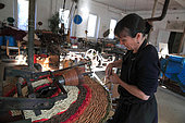 Frédérique Fert making a scourtin with coconut thread, Nyons, Provence, France