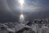 Parhelia (phenomenon of atmospheric optics due to the reflection of sunlight on small ice crystals present in some clouds). Chamonix, Savoy, Alps, France