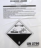 Canister containing sulfuric acid; corrosive logo, France