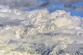 Bionnassay needle under clouds at dusk on a stormy evening, Mont Blanc Massif, Alps, France