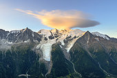 Cloud on Mont Blanc at dawn, lenticular cloud overcoming a mountain peak, Mont Blanc massif seen from Brévent, Haute Savoie, Alps, France