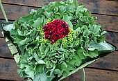 Floral cushion decoration with Lady's mantle leaves and flowers