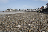 Absence of sand due to a storm that swept everything to reveal only the pebbles in Val-André, Brittany, France