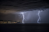 Two branched lightning strikes on Lake Geneva, facing Evian, during the stormy degradation of March 13, 2017, Haute-Savoie, France