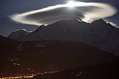 Mont Blanc massif with cap cloud lit by the moon, Saint-Gervais-les-Bains, Haute-Savoie, France, april 1st, 2018