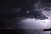 Thunderstorm with heavy rain and lightning strike over Lake Geneva, between Thonon-les-Bains, France and Lausanne, Switzerland, June 5, 2018
