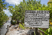 Precautionary sign towards crocodiles, Chinchorro Banks (Biosphere Reserve), Quintana Roo, Mexico