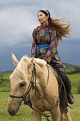Mongolian woman with her horse, Bashang Grassland, Zhangjiakou, Hebei Province, Inner Mongolia, China