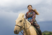 Mongolian woman with her horse, Bashang Grassland, Zhangjiakou, Hebei Province, Inner Mongolia, China