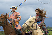 Mongol on a horse, with a catch lasso, Zhangjiakou, Bashang Grassland, Hebei Province, Inner Mongolia, China