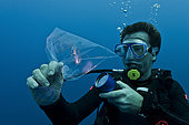 Tara Oceans Expeditions - May 2011. Daniel Cron, first mate and chief engineer of Tara, sampling plancton for o/b scientists, Galapagos