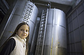 Alessandra, 7 years old, in the olive oil factory in Kritsa, Crete, Greece