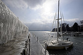 Ice on the port of Versoix, during the episode of bise 27 February 2018. In late winter, the stormy wind rises and causes an episode of ice around Lake Geneva. In Versoix (Switzerland), September 27, 2018, the spray instantly freezes in contact with the ground and frozen surfaces, Switzerland