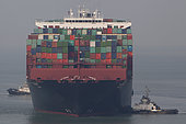 Container ships and tugs, Port Kelang, Malaysia.