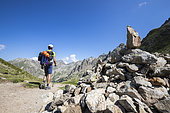 A young hiker crossed the Baisse des Cinq Lacs (2335 m), the Madone de Fenestre valley, Haute-Vésubie, Mercantour National Park, Alpes-Maritimes, France
