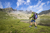 Young hiker around the lakes of Prals (2280 m), valley of the Madone de Fenestre, Haute-Vésubie, Mercantour National Park, Alpes-Maritimes, France