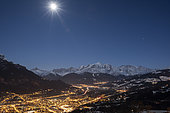 Light pollution in Sallanches and the Arve Valley, Mont-Blanc Massif illuminated by moonlight, Alps, France