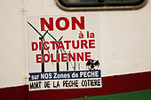 "No to the dictatorship Aeolian", large sticker claim stuck on the hull of a fishing boat in the Bay of Somme, Picardy, France