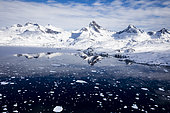 Panoramic view from helicopter, coast with mountains and sea, around Tasiilaq, East Greenland