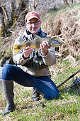 Trout fishing on the Loue river, Presentation of a wild trout (Salmo trutta fario), Franche-Comté, France