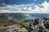 View from Remarkables mountain range on Lake Wakatipu with city of Queenstown, South Island, New Zealand