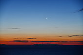 Moon and sunrise over Corsica from the Esterel Massif, France