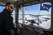 From the lookout or "nest of magpie", the second captain of the Astrolabe Julien Duroussy observes high the pack to find the best route to follow to cross and not get stuck. For this he is in constant contact with the captain on the bridge via VHF. Adélie Land, Antarctica
