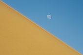 Moonrise over a sand dune, Skeleton Coast National Park, Namibia.