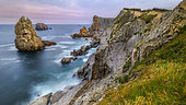Twilight on the Cantabrian coast. Needles of Liencres, near Santander, Spain