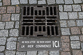 Information on a manhole cover in Villers-sur-Mer, Normandy, France