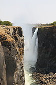Basalt canyon 100 m deep at the exit of Victoria Falls in August 2019, 1/4 to 1/3 of water missing, Dry season, North Zimbabwe