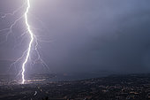 Lightning strike in Geneva during the storm on July 25, 2019. Shooting from Mont Salève, 1000m above Geneva. Haute-Savoie, France