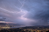 Thunderstorm of July 25, 2019 in Geneva. Lightning crawling on the sides of a cumulonimbus overlooking Geneva. Shooting from Mont Salève. Haute-Savoie, France
