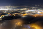 Stratus above Geneva, December 12, 2019. Atmospheric and light pollution over Geneva and its suburbs. Shooting from Mont Salève, Haute-Savoie; France