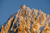 Aiguille du Midi and its cable car, at sunset, February 06, 2020. Shooting from Les Houches, Haute-Savoie, France