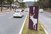 Entrance sign to the city of Nara indicating the risk of deer on the road, Nara, Japan