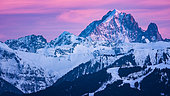 Aiguille Verte and the Drus at dusk. Shooting February 2020. In the foreground of the panorama, on the right, we can see the Club Med of Samoëns. Haute-Savoie, Franc