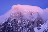 Aiguille du Midi in the stratus at dusk. Shot of February 2020, from Les Houches, Haute-Savoie, France