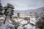 The village and the Notre-Dame-de-l'Assomption church during a snowfall, Moustiers-Sainte-Marie, labeled Les Plus Beaux Villages de France, regional natural park of Verdon, Alpes-de-Haute-Provence, France