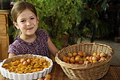 Little girl, 6 years old, preparing mirabelle plum tart, cooking, Belfort, France