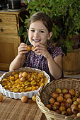 Little girl, 6 years old, preparing mirabelle plum tart, cooking, Belfort, France
