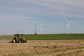 Scumming tractor and wind turbines, North of France