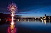 Fireworks, reflection in Lake Schliersee, St. Sixtus Parish Church, Schliersee, Upper Bavaria, Bavaria, Germany, Europe